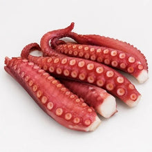 Load image into Gallery viewer, Sashimi-grade frozen octopus legs with visible suction cups
