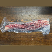 Load image into Gallery viewer, Frozen cooked octopus legs in vacuum-sealed packaging
